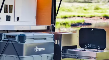 Check out the Truma cooler for a camp fridge/freezer